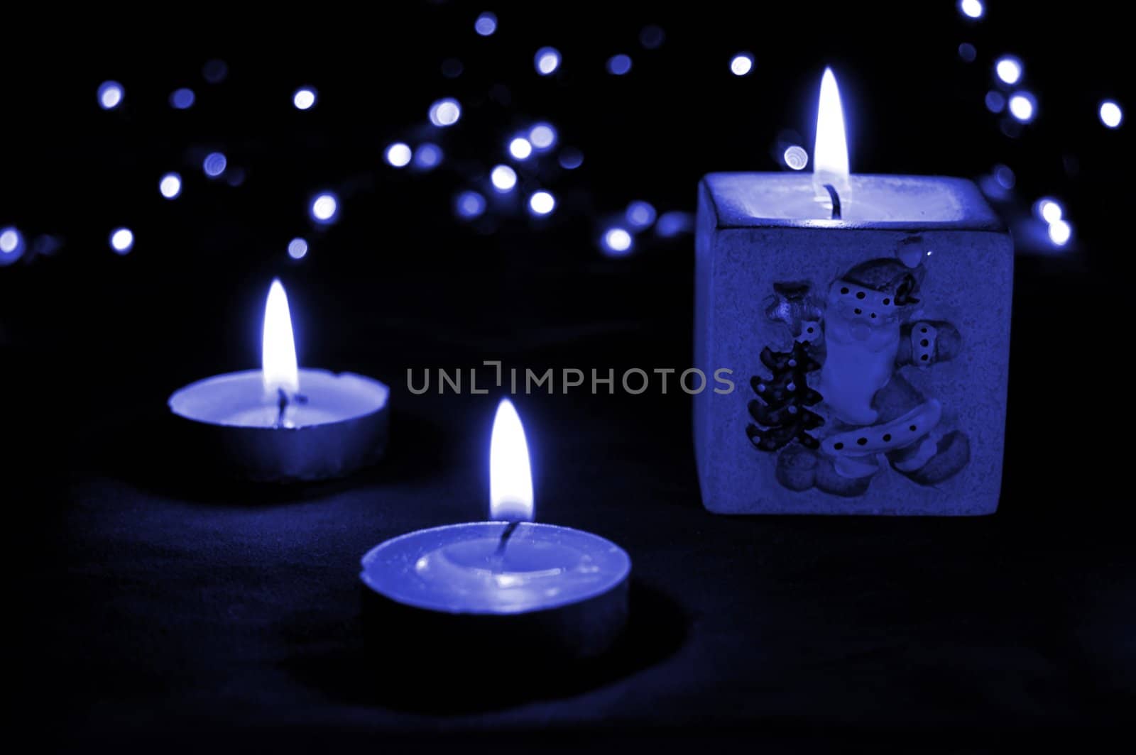 Christmas candle light in blue tones