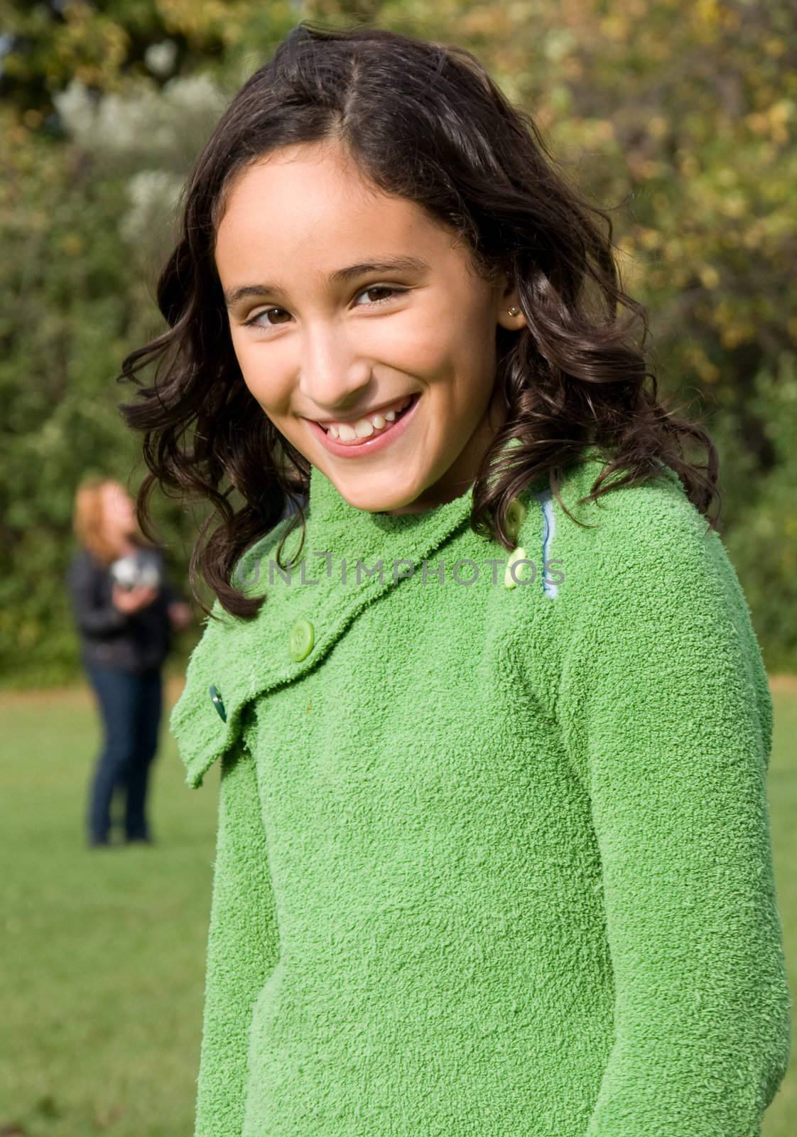 A Young Girl's Vertical Portrait taken at the park.