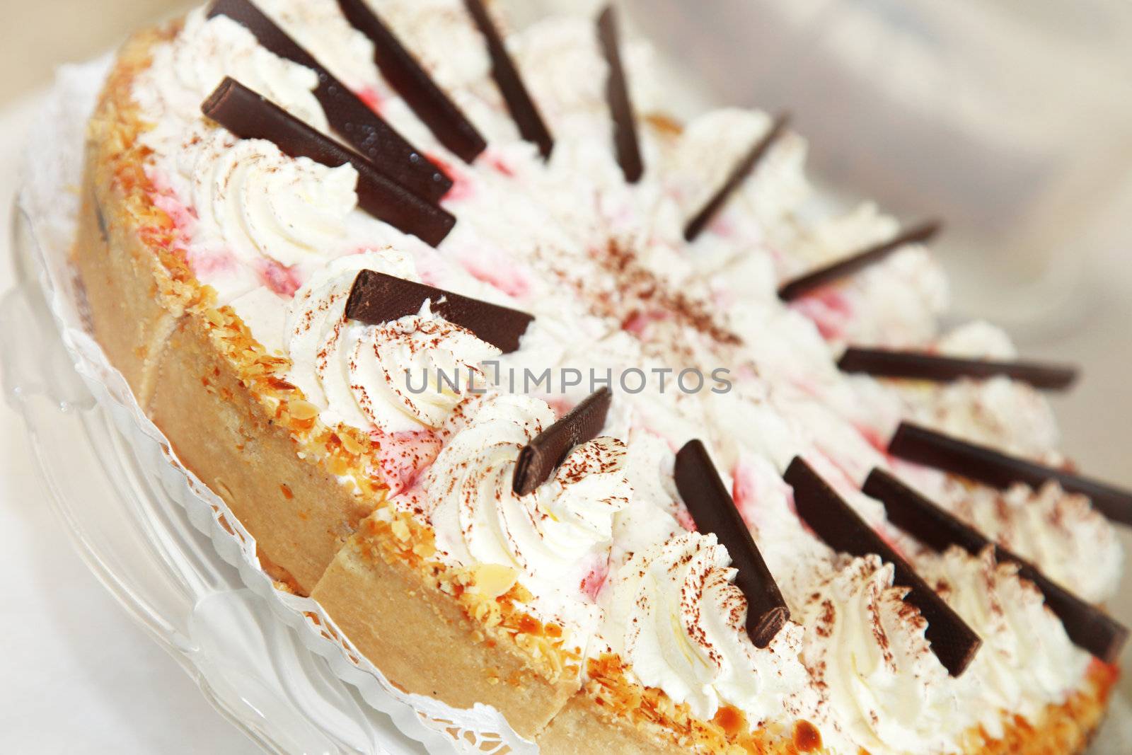 Cream-strawberry cake decorated richly