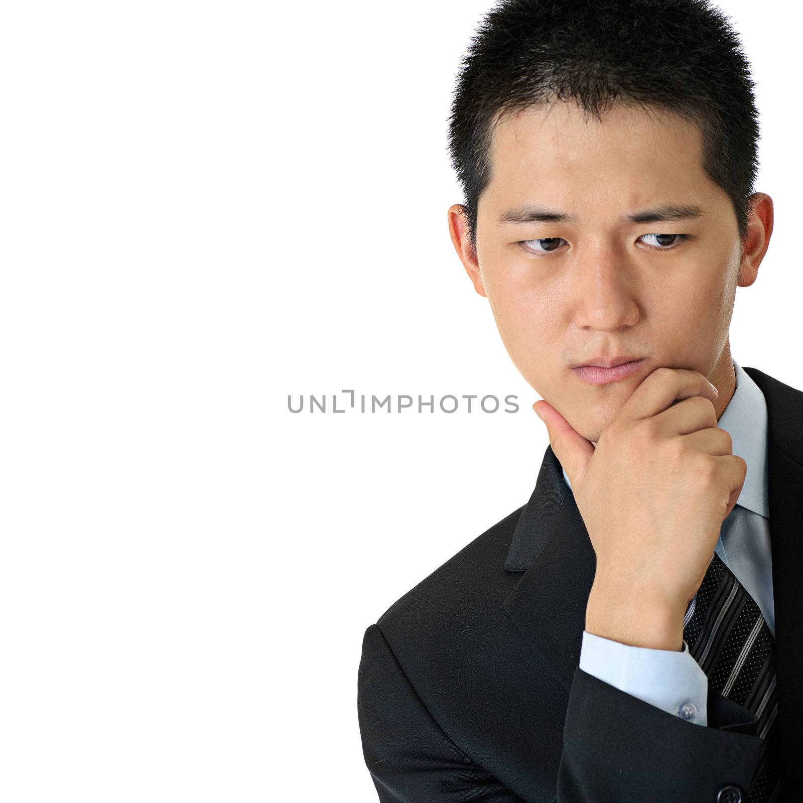 Thinking expression of young businessman on white background.