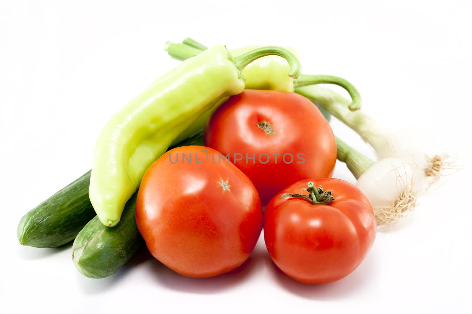 Mix from tomato, garlic, onion, pepper and cucumber. Isolated on white background.