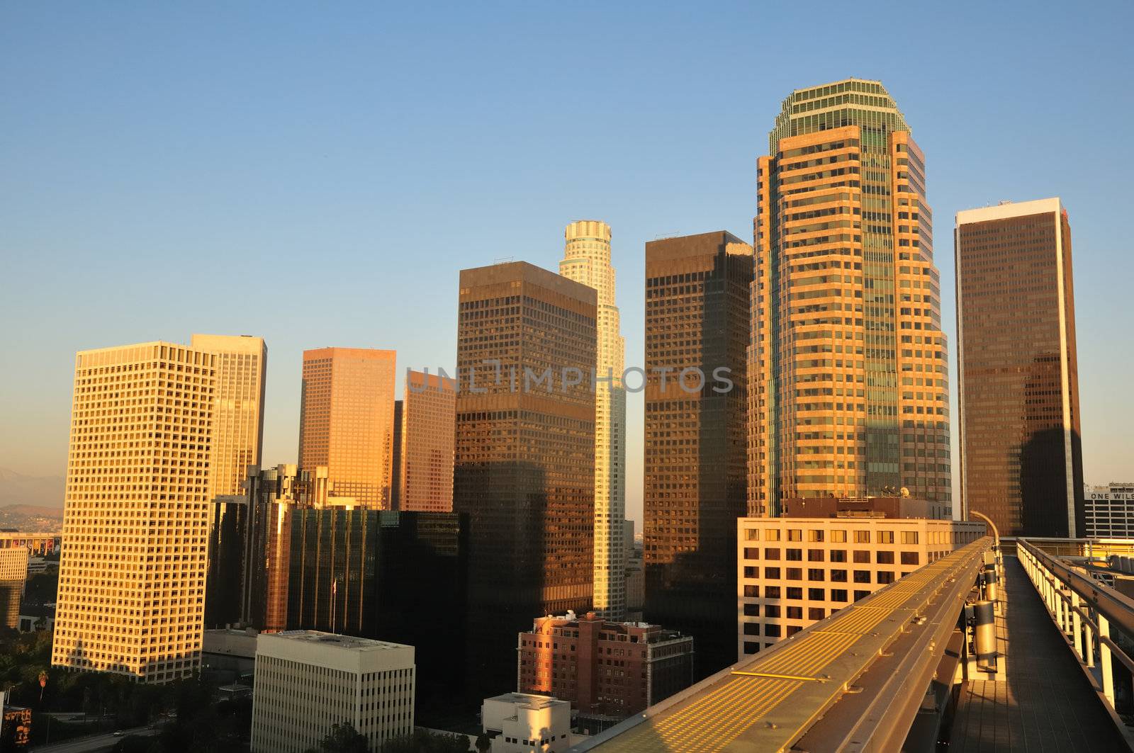 Skyscrapers tower over a rooftop walkway in downtown Los Angeles