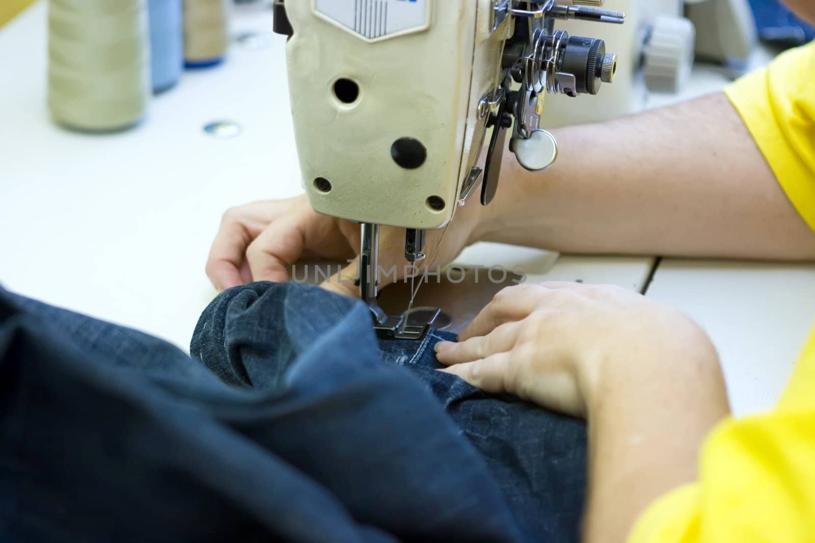 A tailor working on a sewing machine