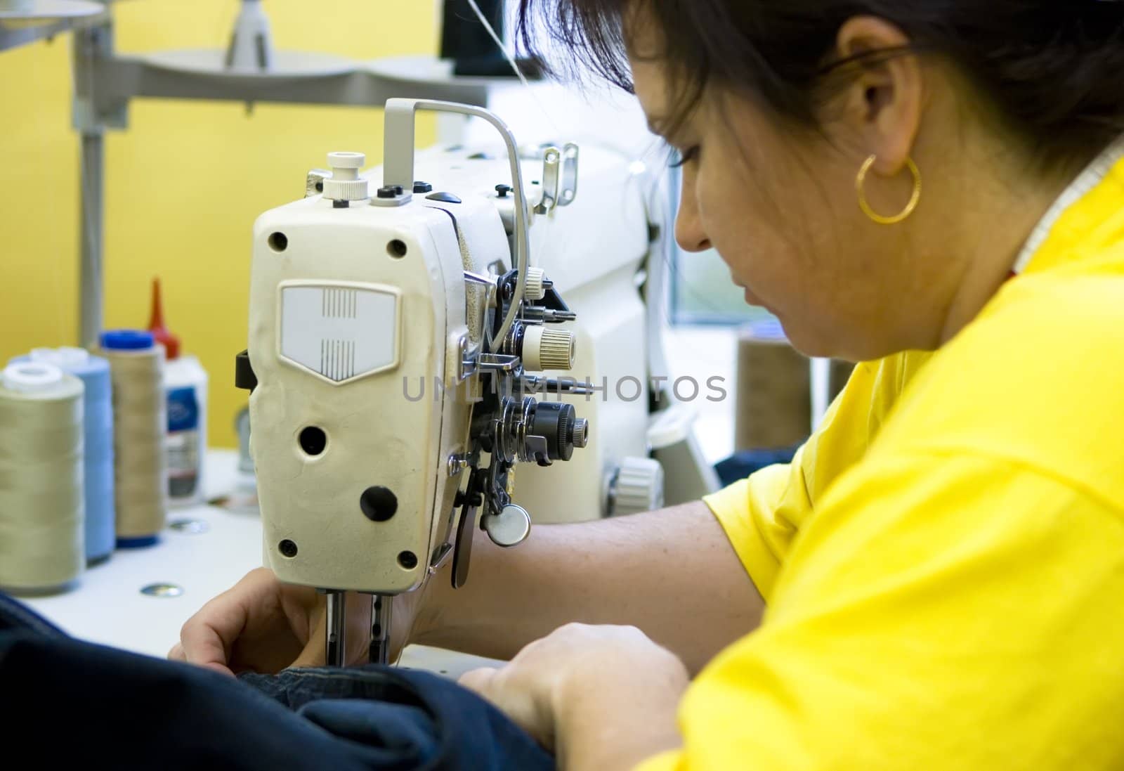 A tailor working on a sewing machine