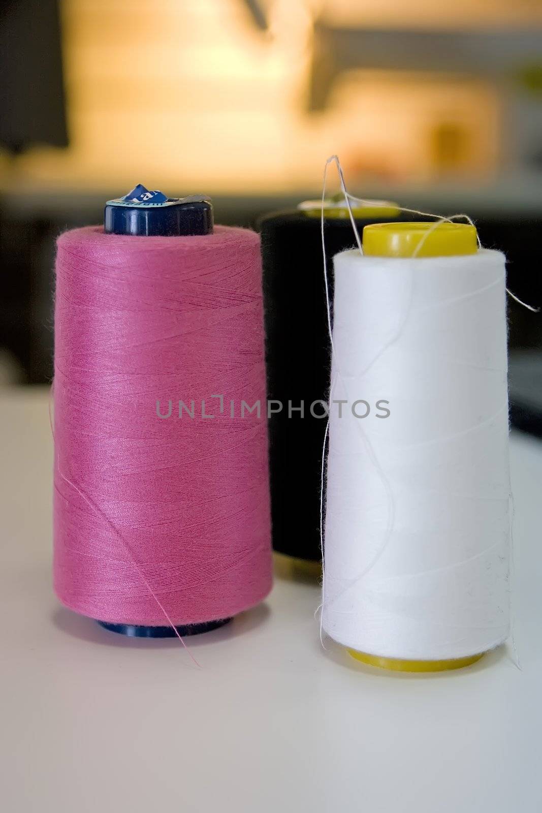 Spools of threads standing on the table