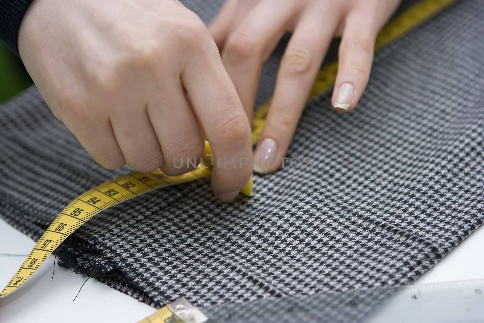Tailor making measurements on trousers