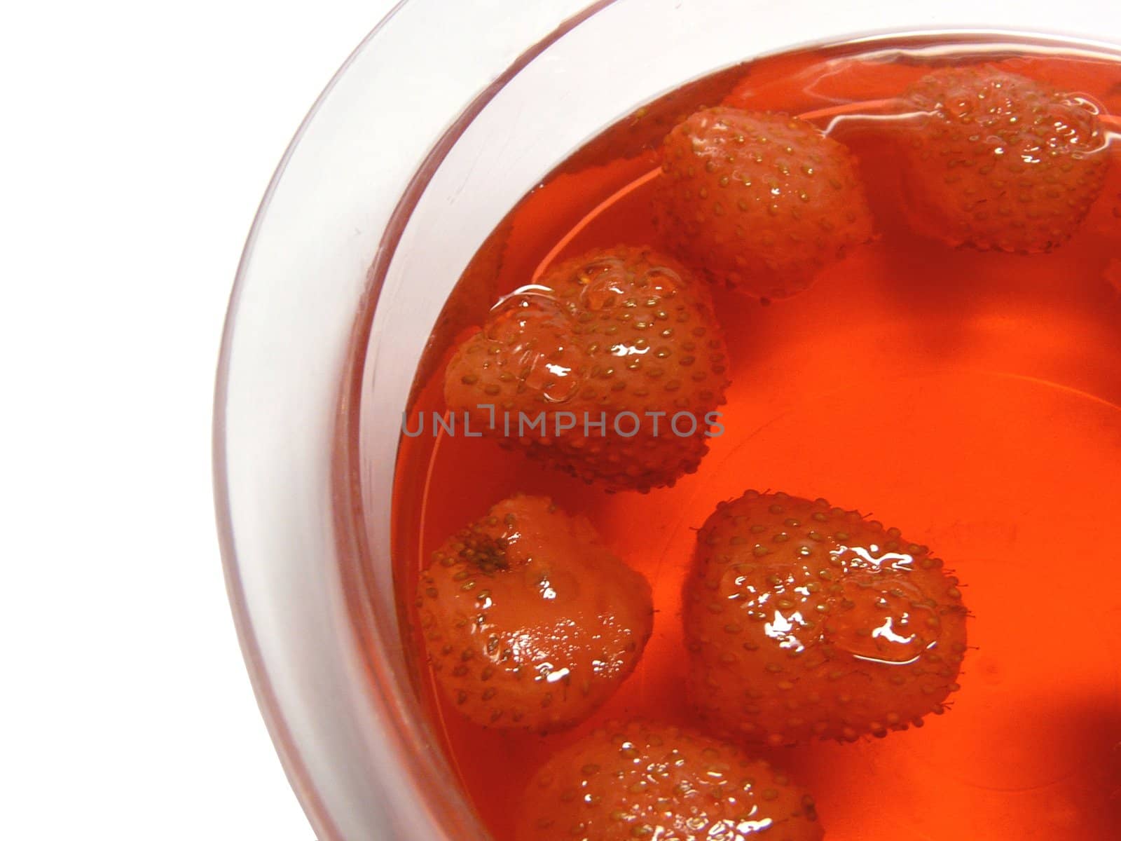 Jellied strawberries on the white background