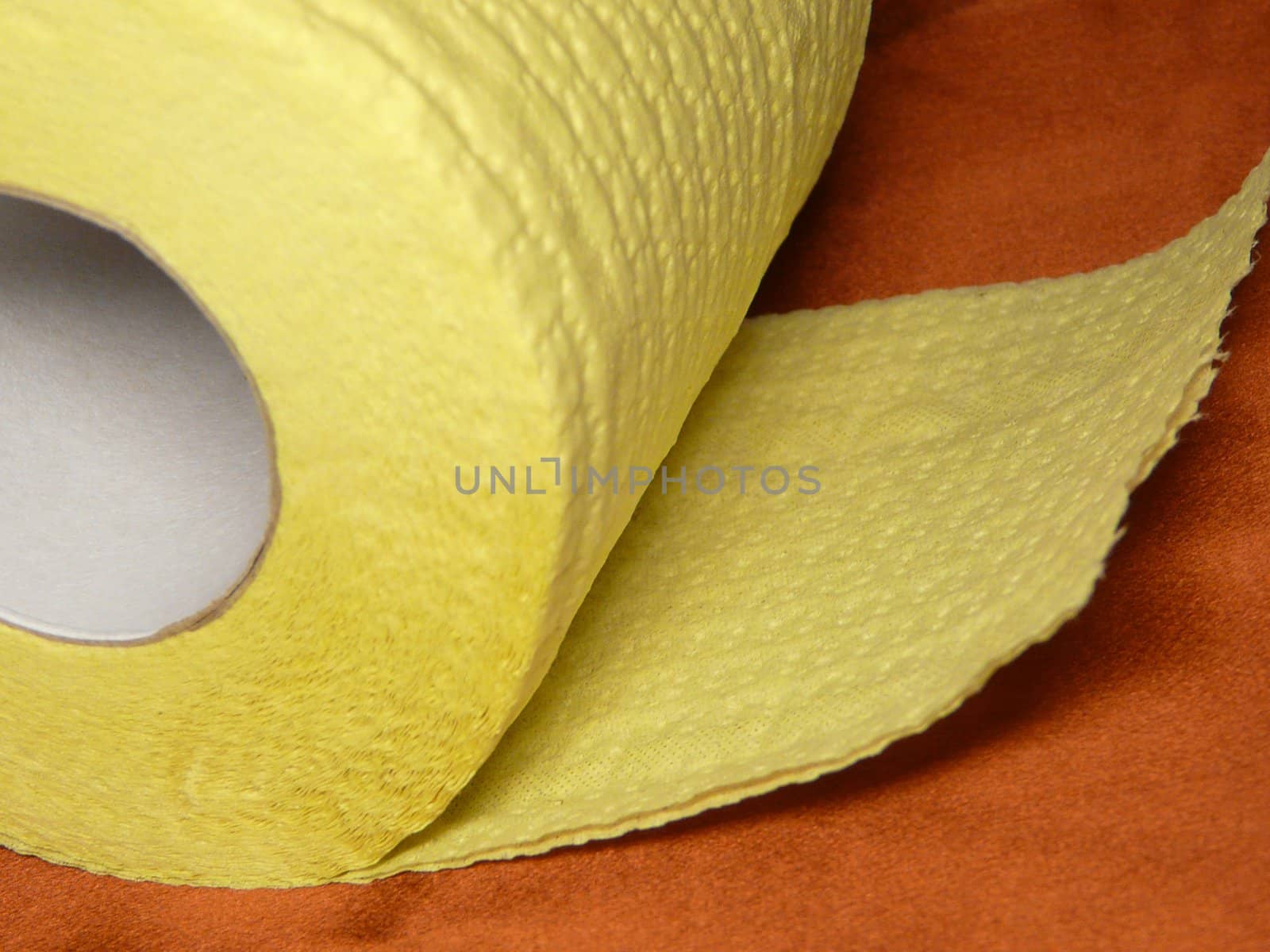 Big roll of soft yellow toilet paper