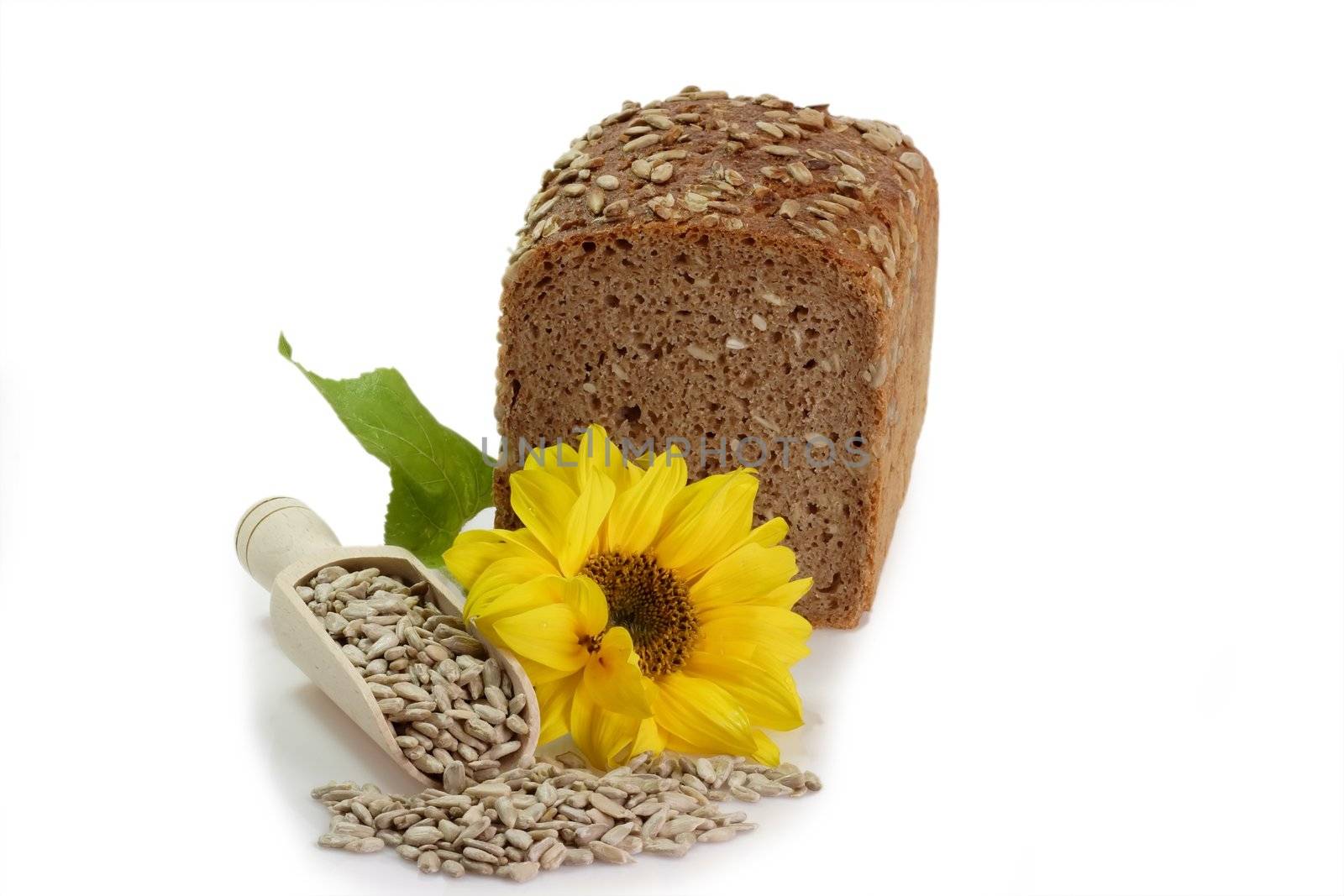 Whole multi-grain-bread with sunflower seeds on white background