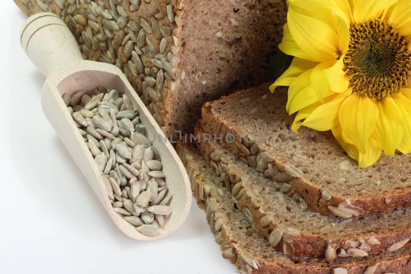 Sliced multigrain bread with sunflower seeds and sunflower blossom