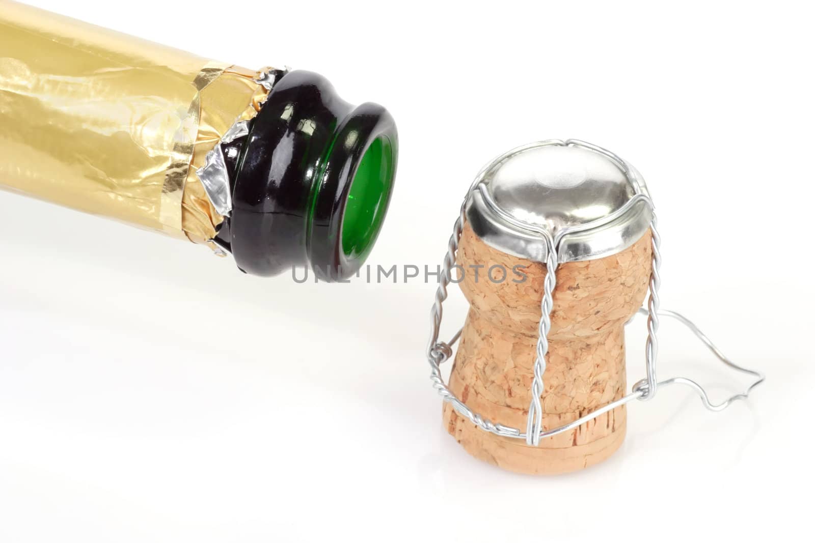 Open champagne bottle with cork on white background