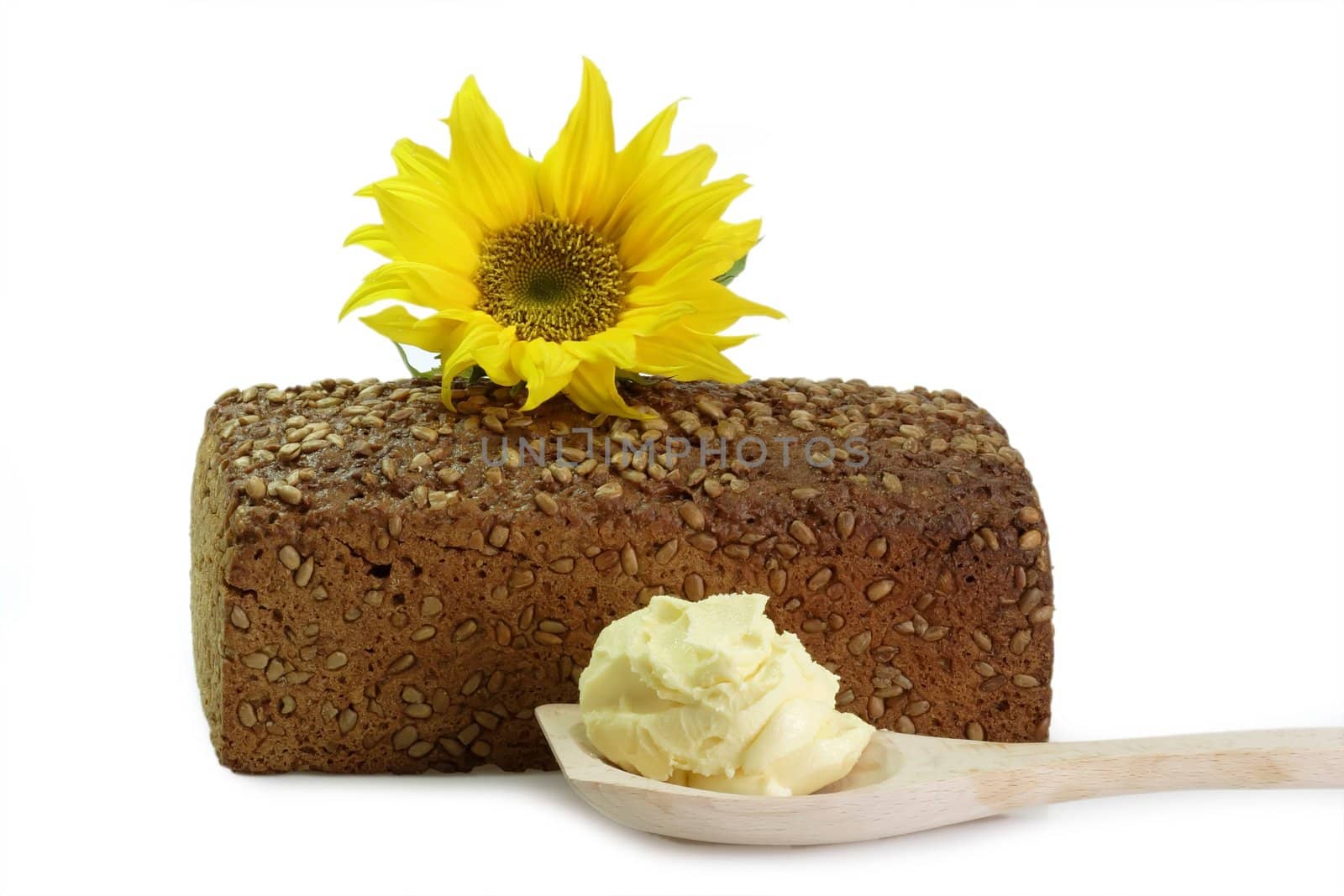 Bread with Oleo on a Cooking Spoon and Sunflower on white background