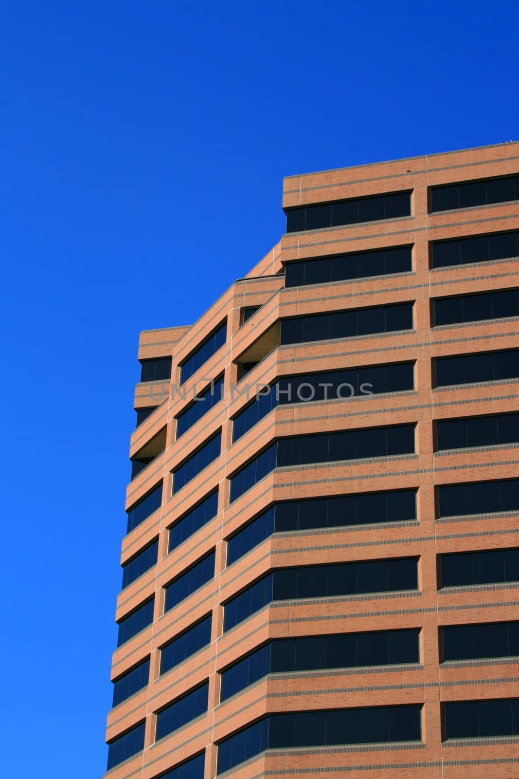 Close up of a modern building over blue sky.
