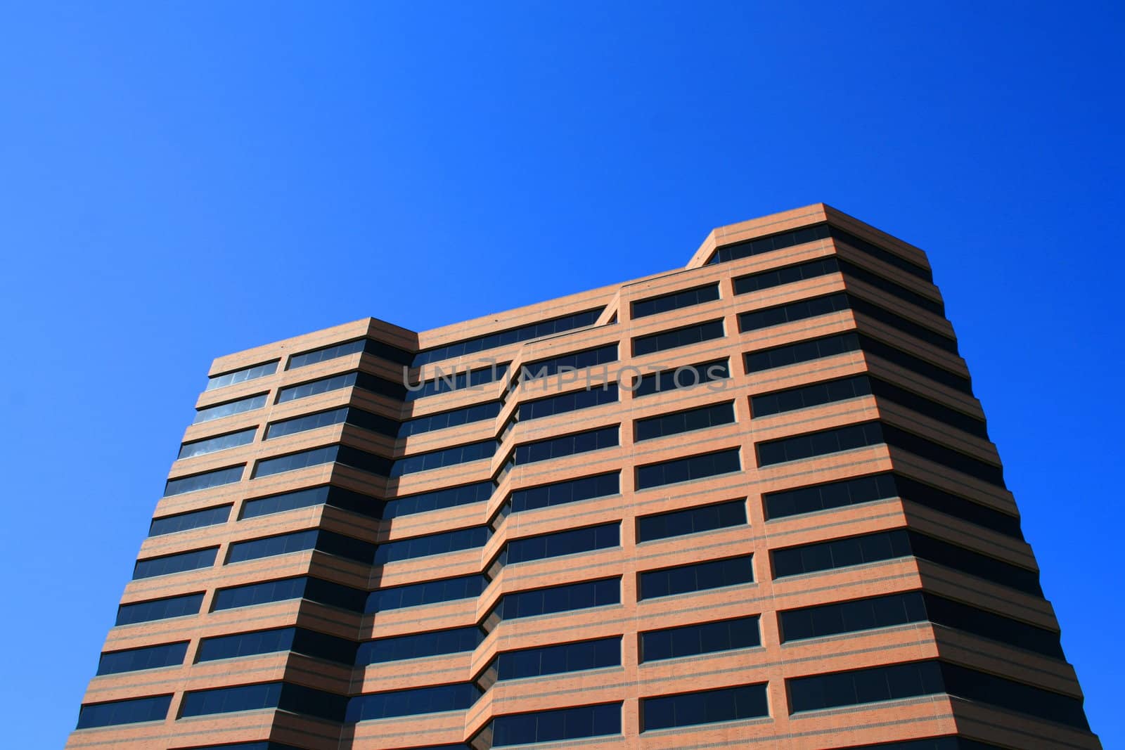 Close up of a modern building over blue sky.
