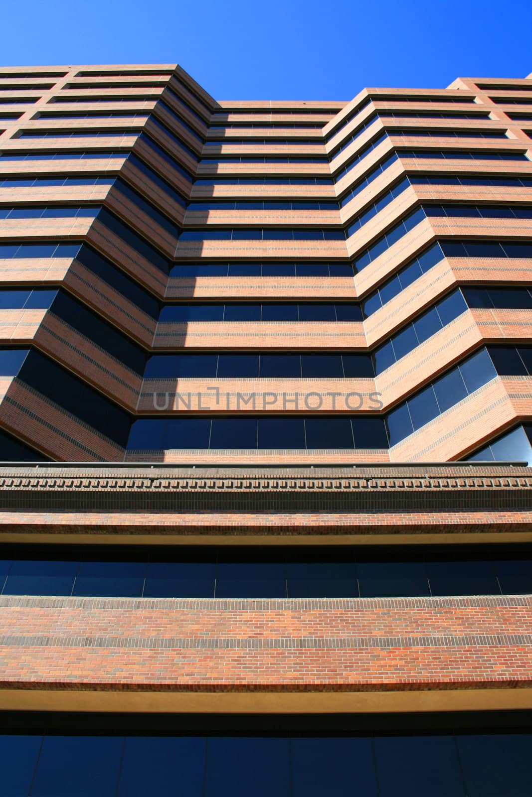 Close up of a modern building over blue sky.
