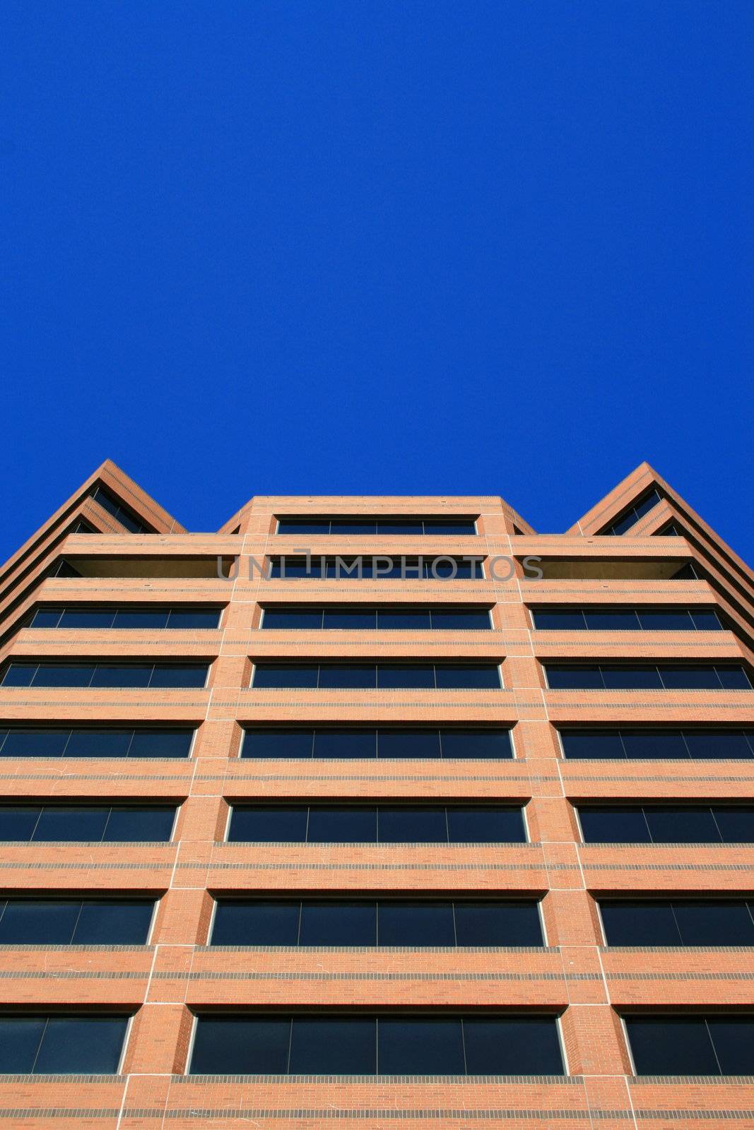 Close up of a modern building over blue sky.
