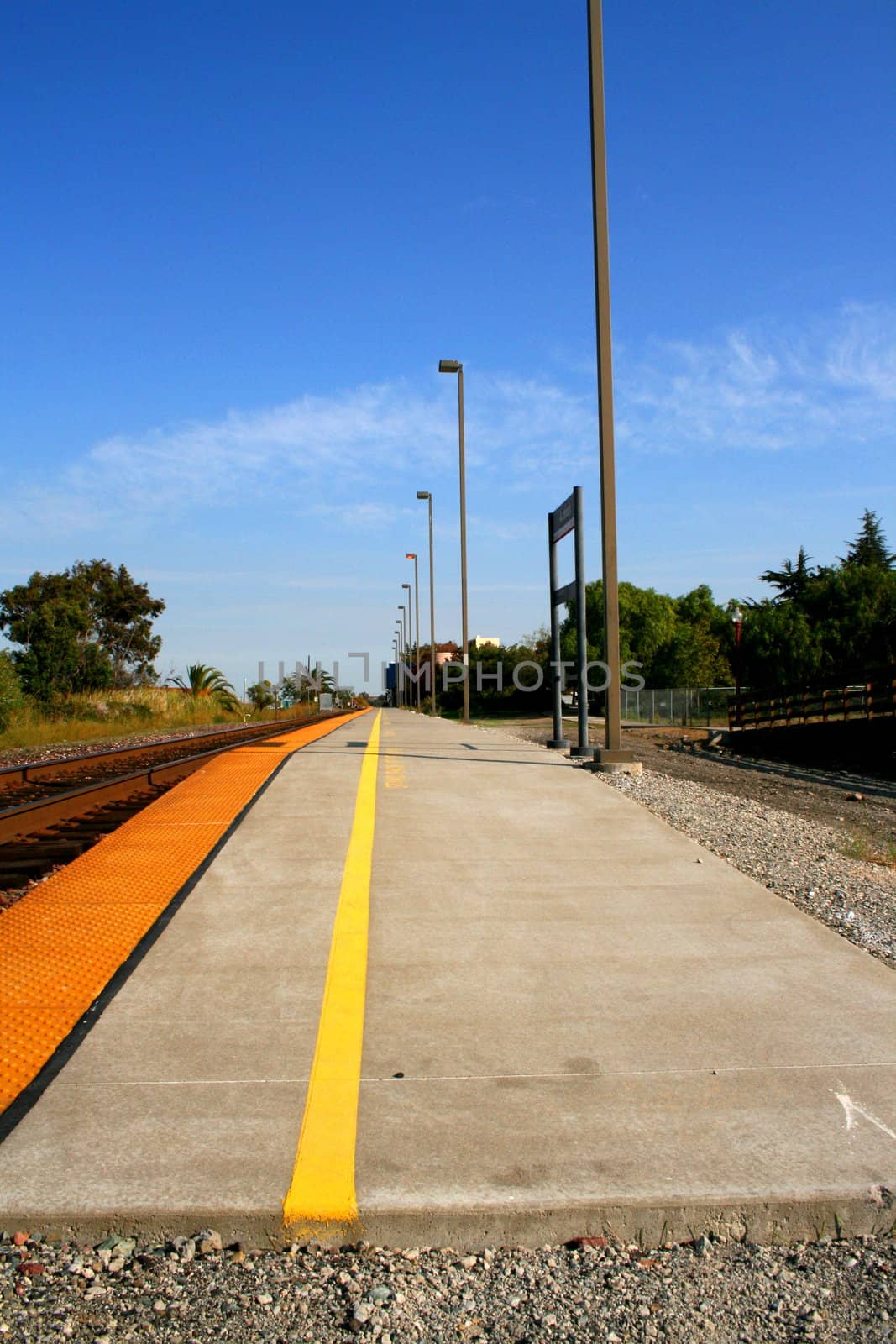 Modern train station during the day with clear blue sky.