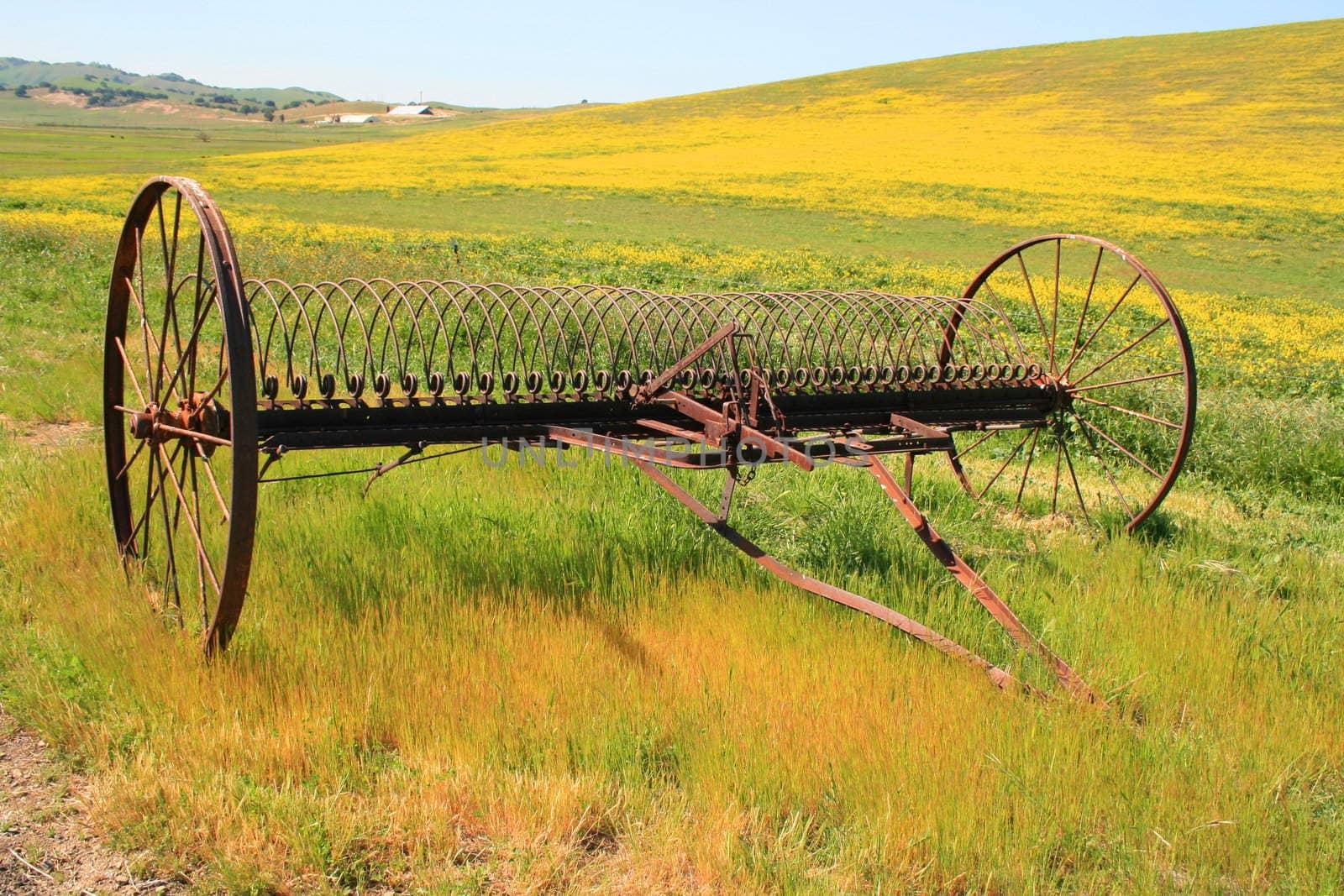 Close up of an old farm plow.
