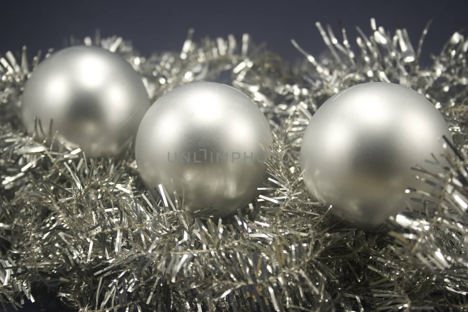 Christmas balls on tinsel by timscottrom