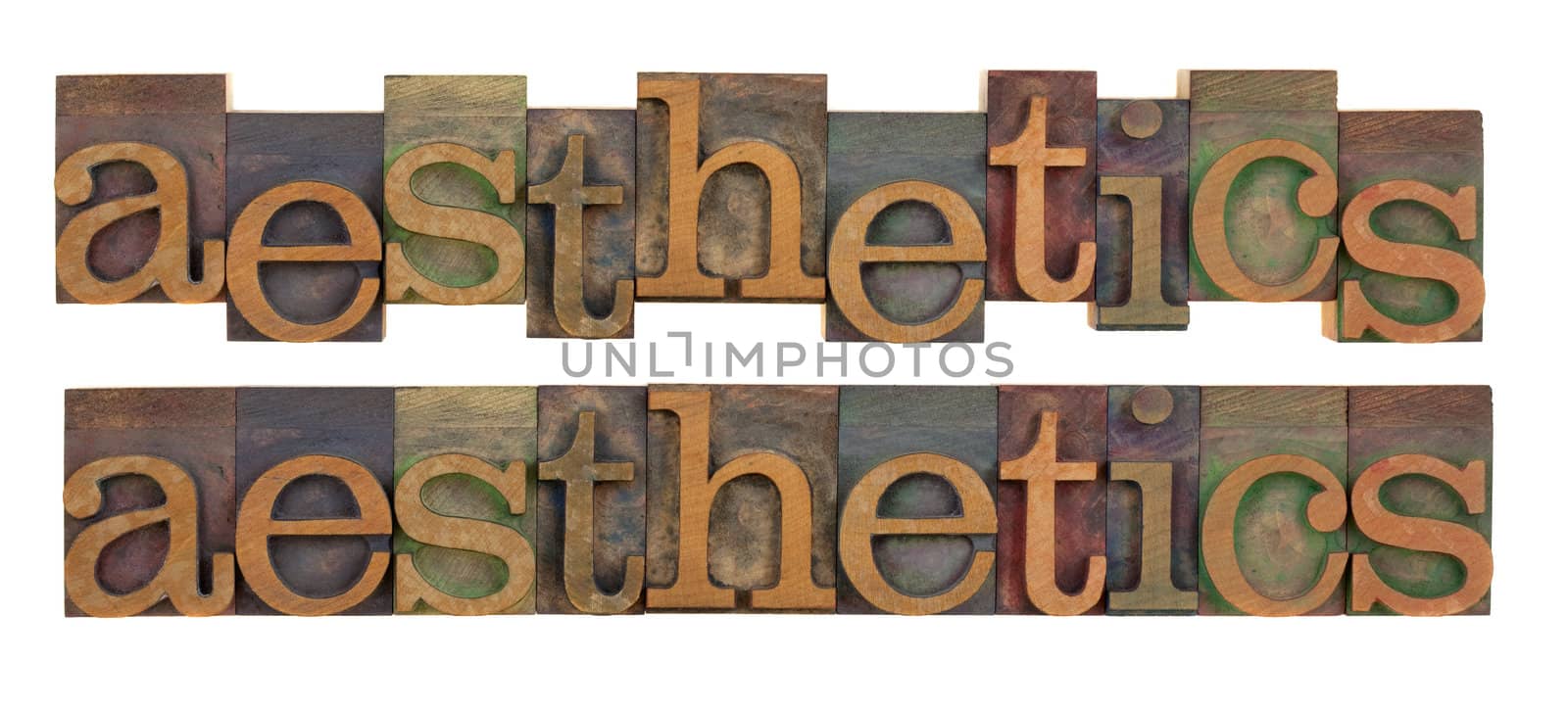 the word of aesthetics in vintage wood letterpress type, stained by color ink, isolated on white, two layouts