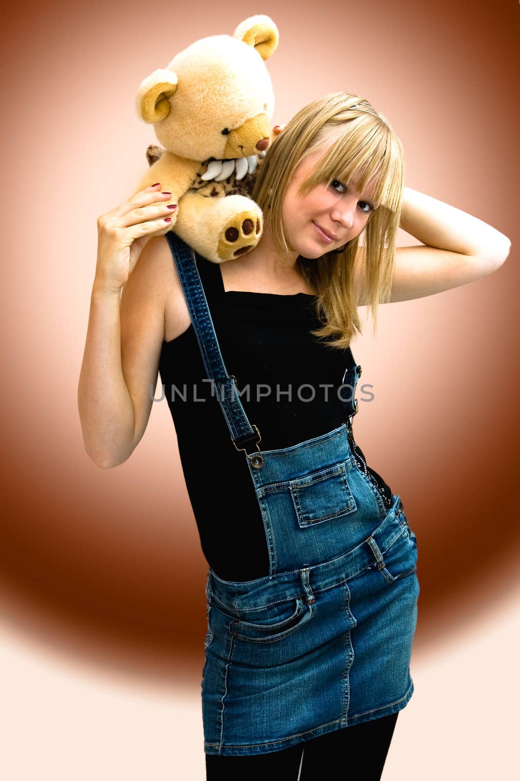 Young girl with a toy bear