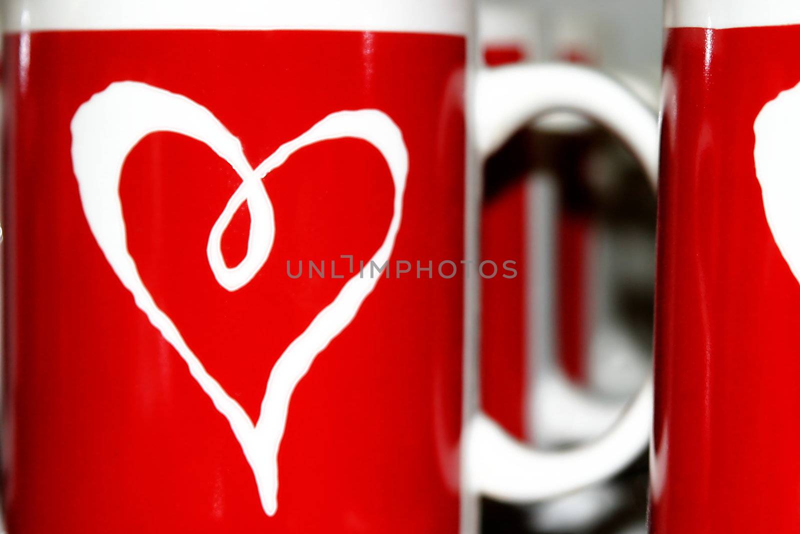 Red and white cups with a heart symbol on it.