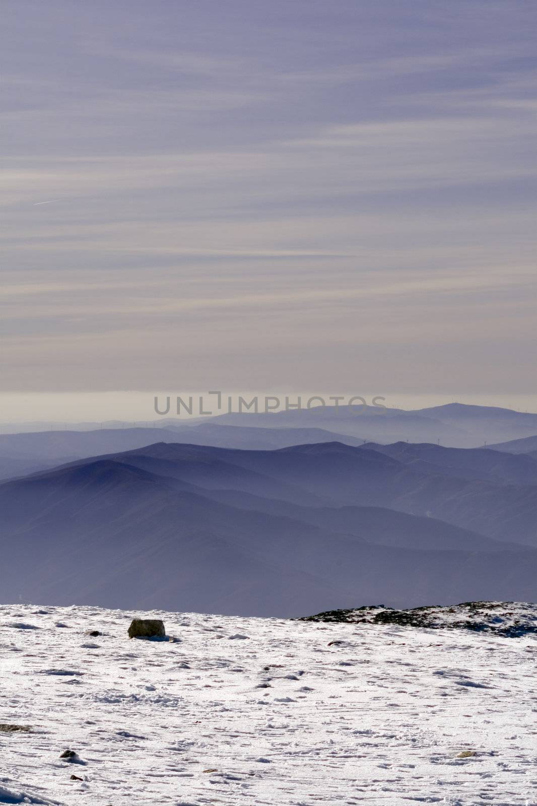 Sunset from one mountain top with snow