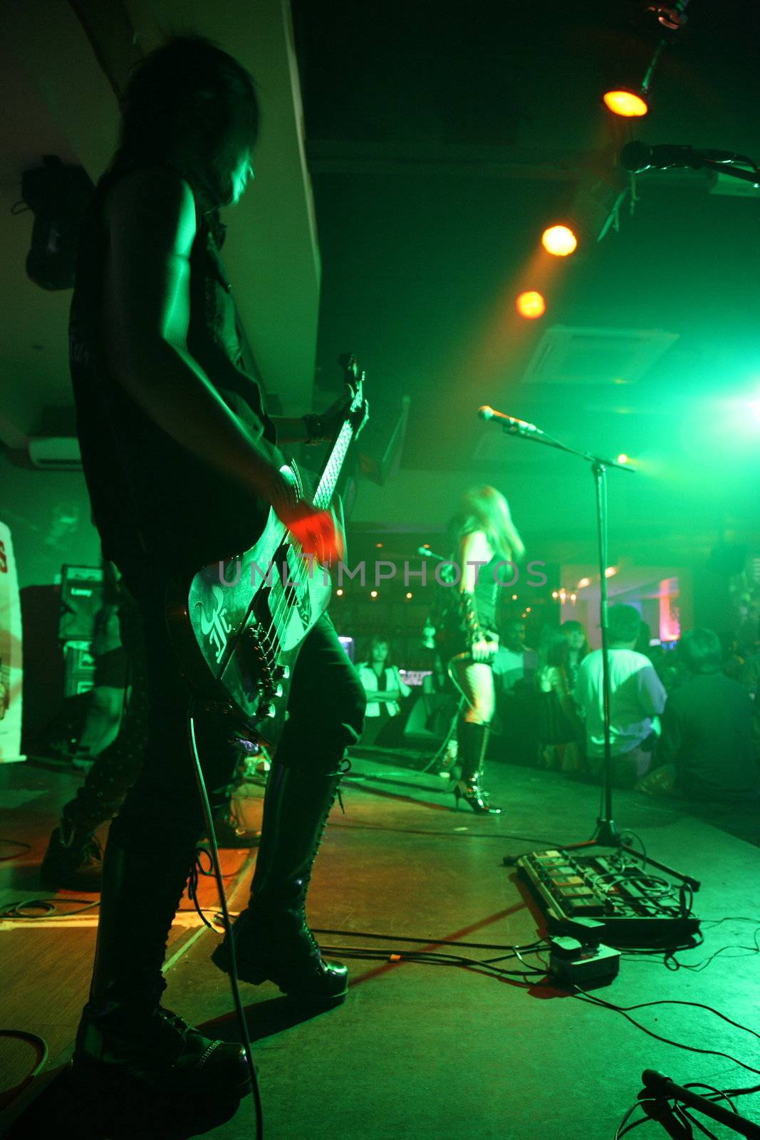 green hue rock concert in a club