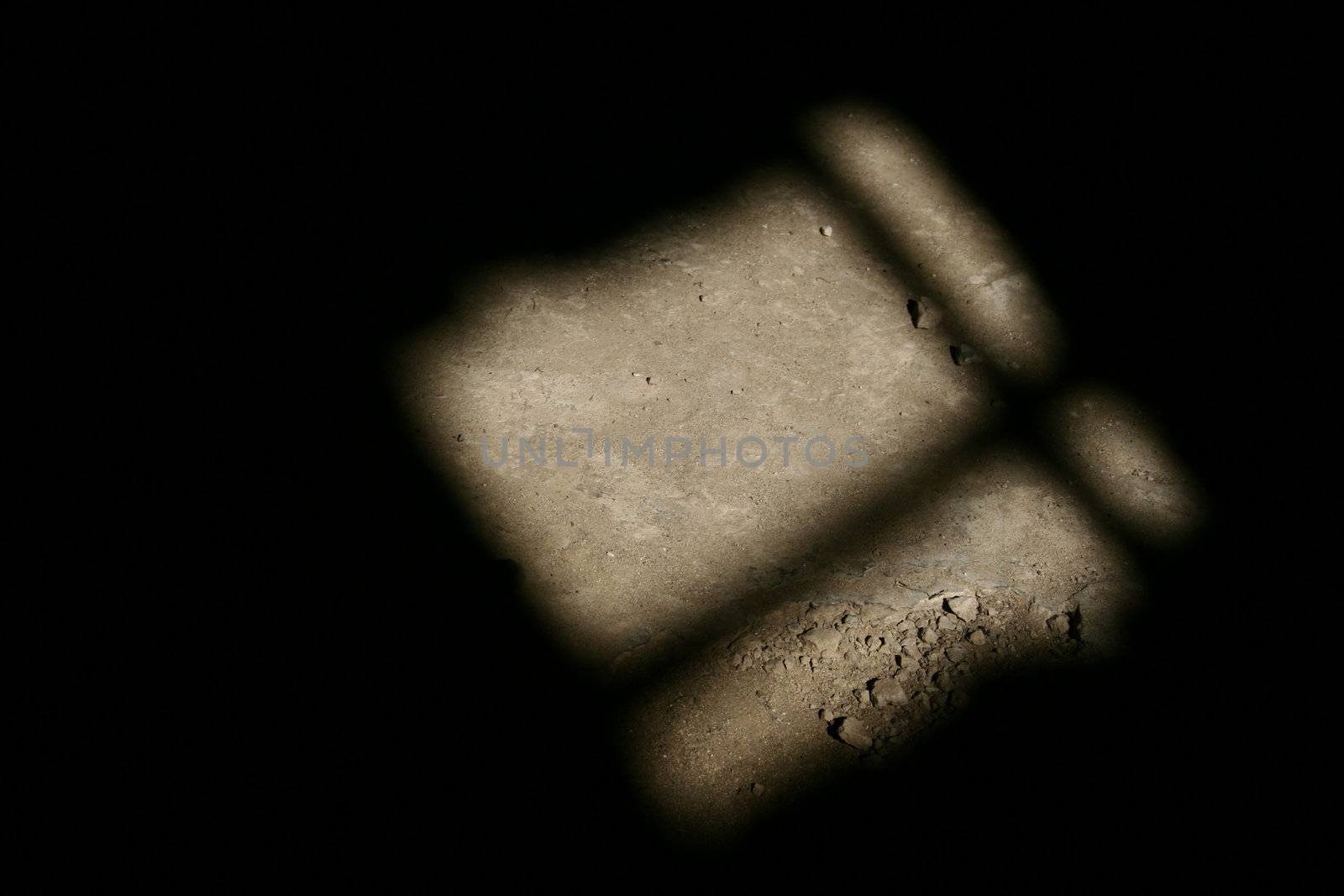An abstract photo of light shining through the window, on the ground. It has quite a lonely, sad, atmosphere to it.