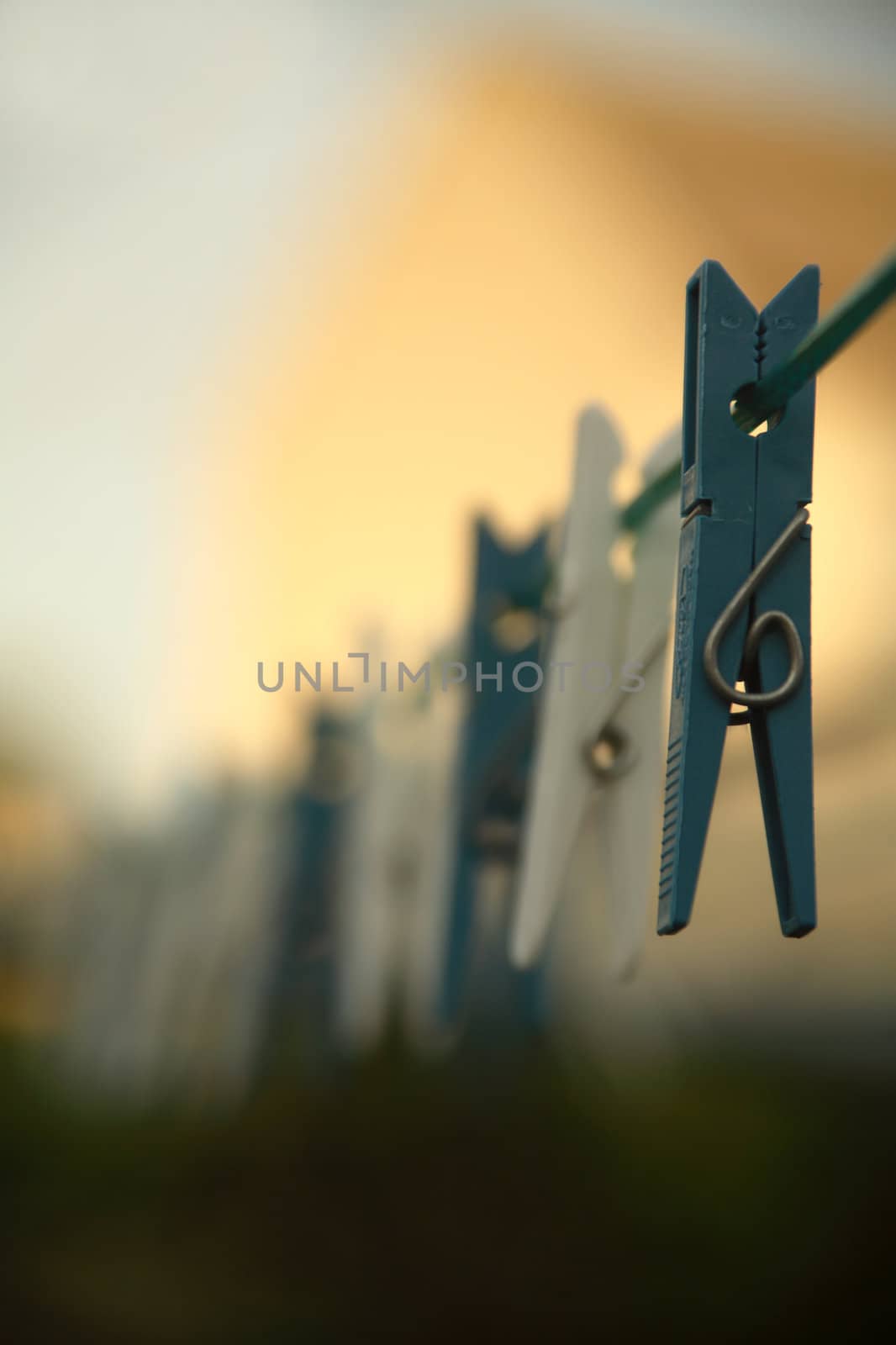 Clothes pegs on a clothes line. (Shallow DOF)