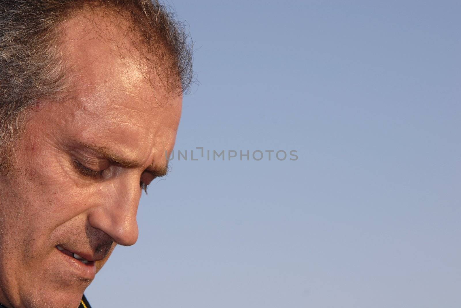 close up man portrait with the sky as background