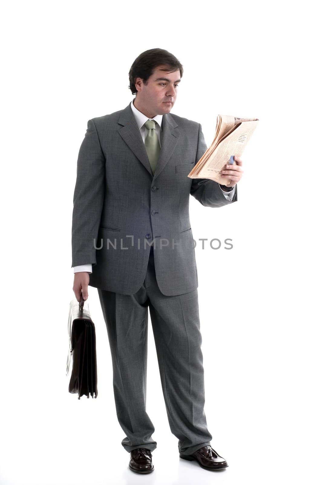 young businessman with a suitcase and a newspaper