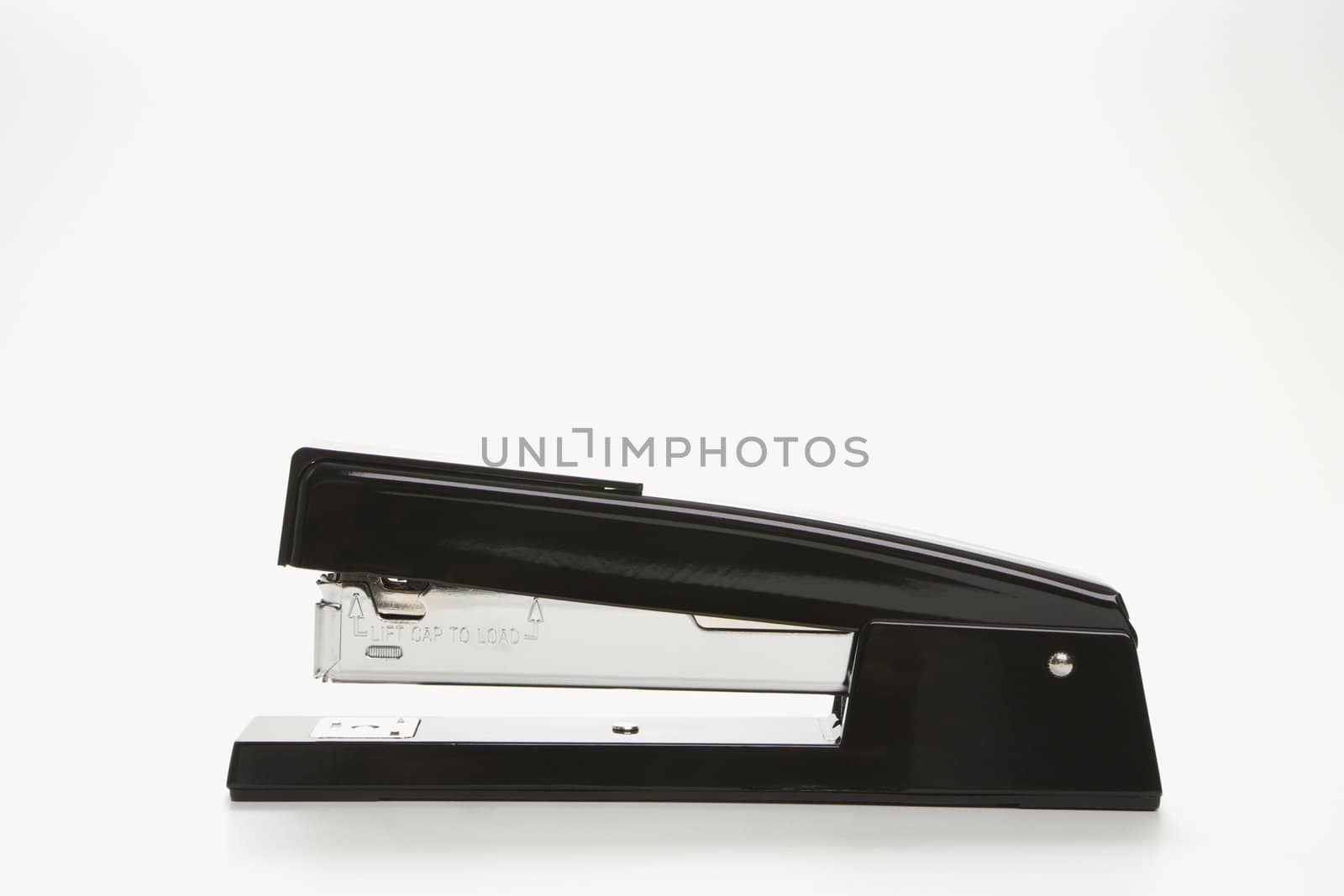 Side view of black stapler on white background.