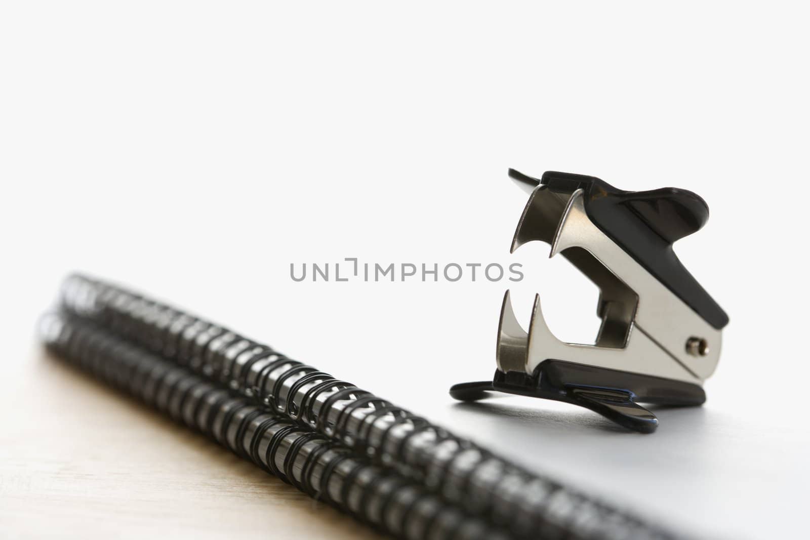 Staple remover on notebook. by iofoto
