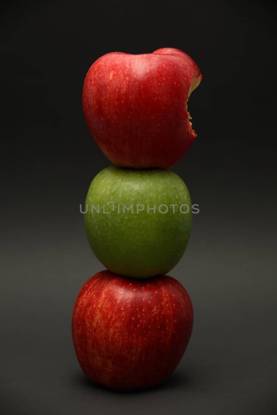 A line of apples with one exception.