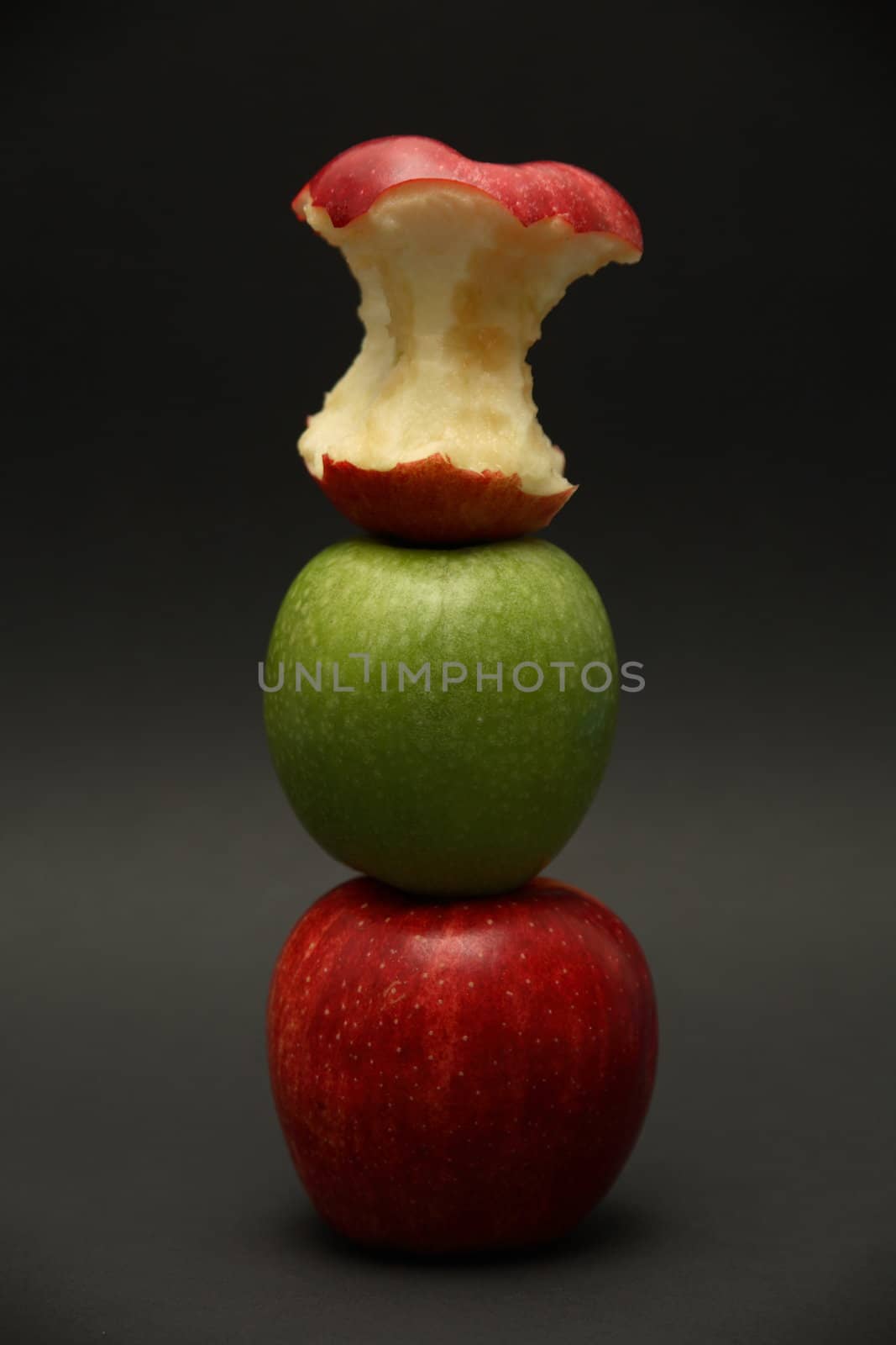 A line of apples with one exception.