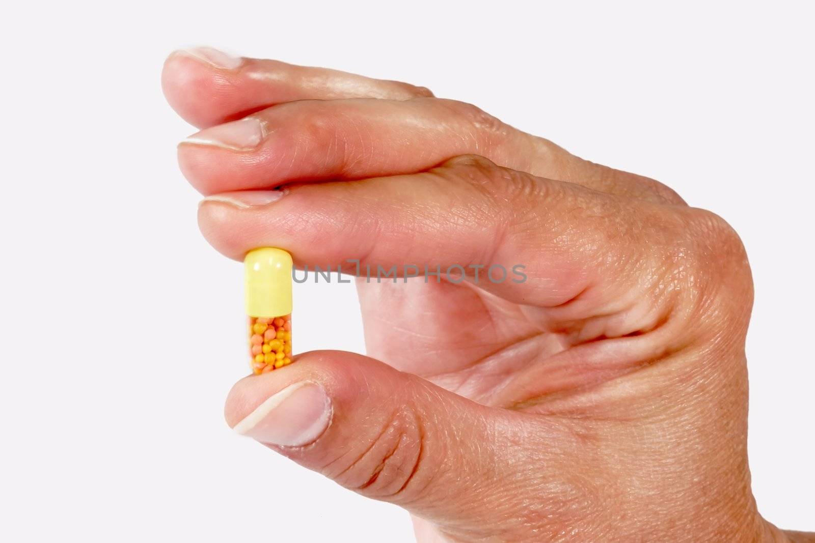 Capsule in a Hand by Teamarbeit