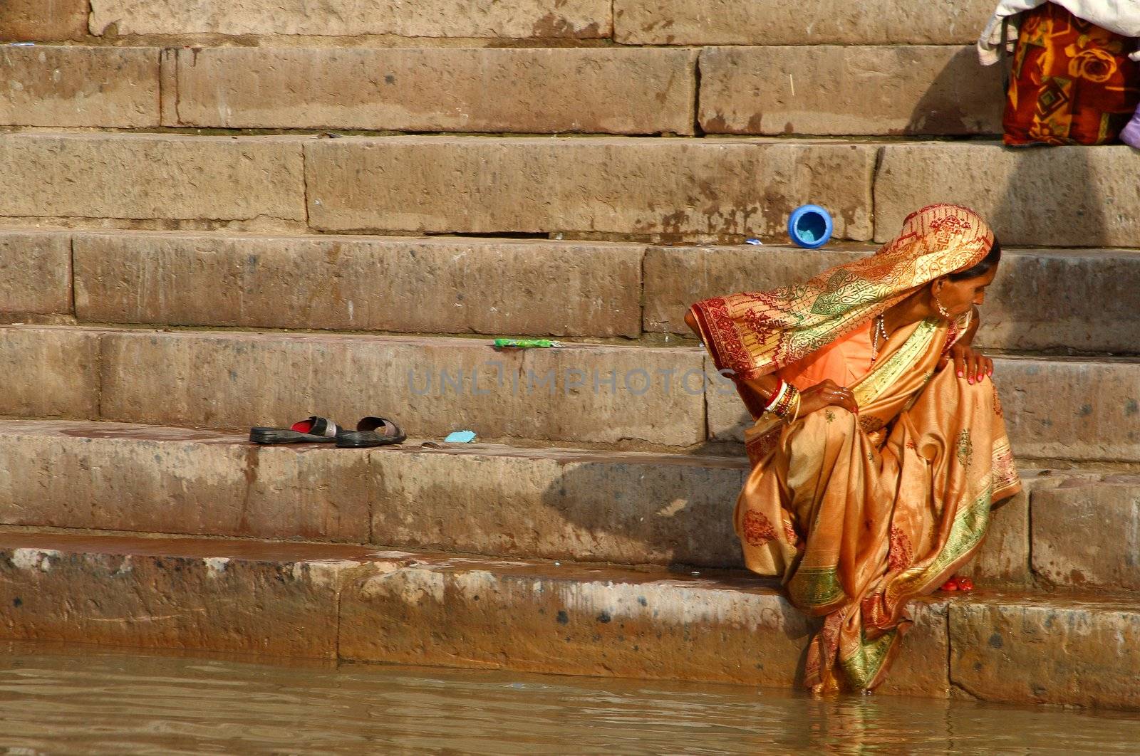 Hindu woman wearing yellow sari - Inadia Varanasi