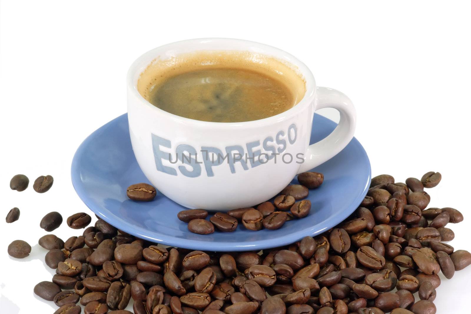 Fresh brewed espresso with coffee beans on light background