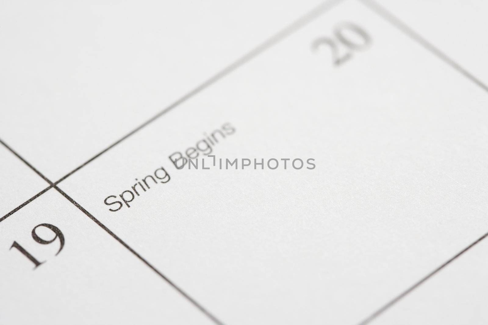 Close up of calendar displaying the beginning of spring.