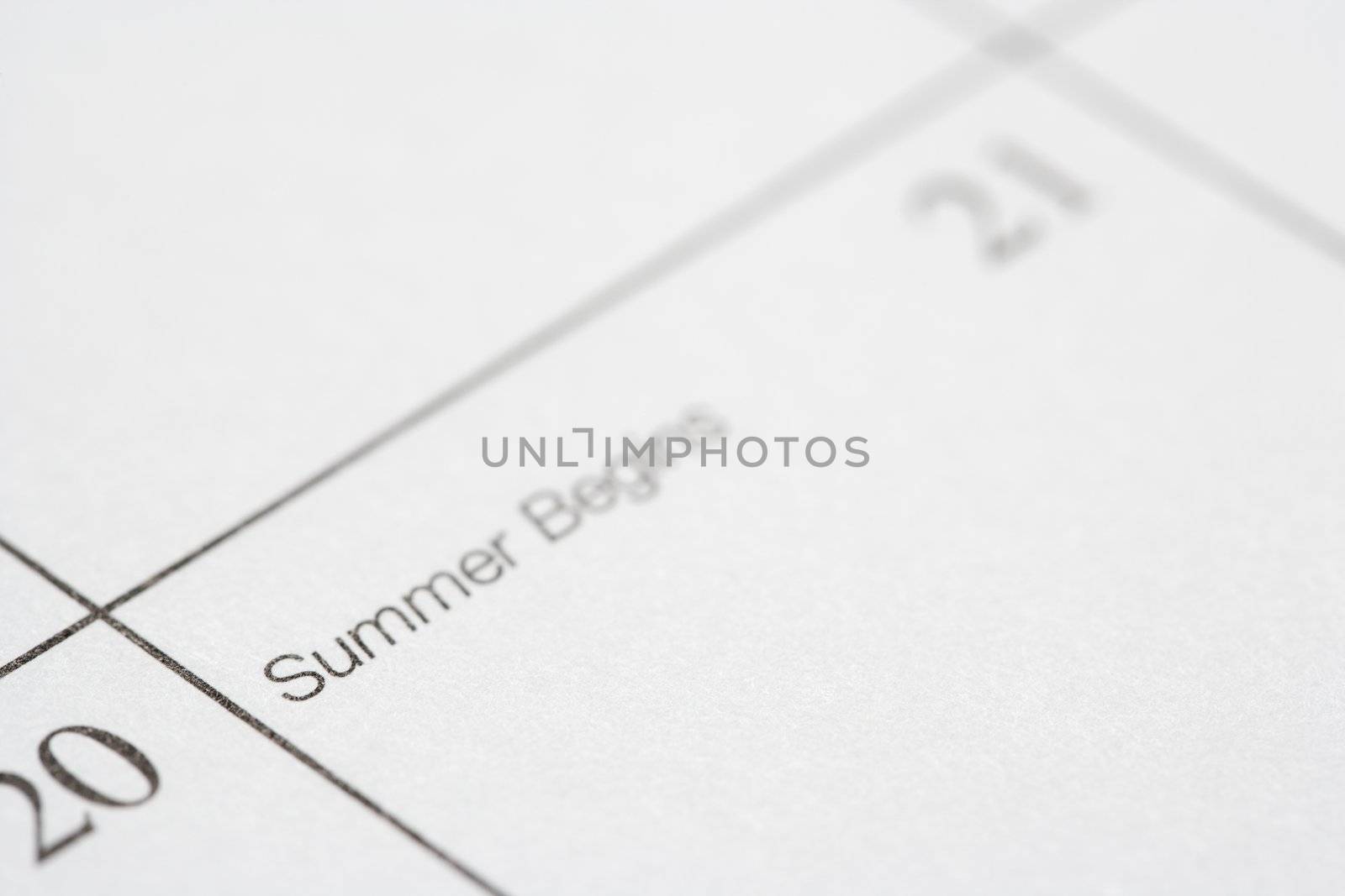 Close up of calendar displaying the beginning of summer.