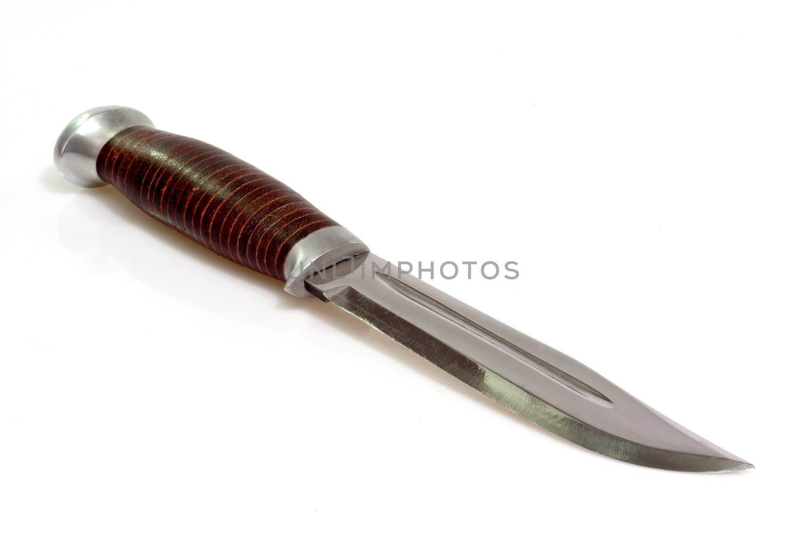 Closeup of a hunting knife on bright background.

