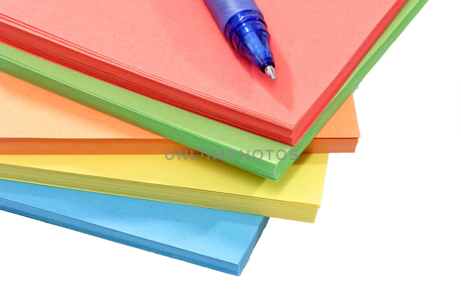 Batch of assorted color paper over white background