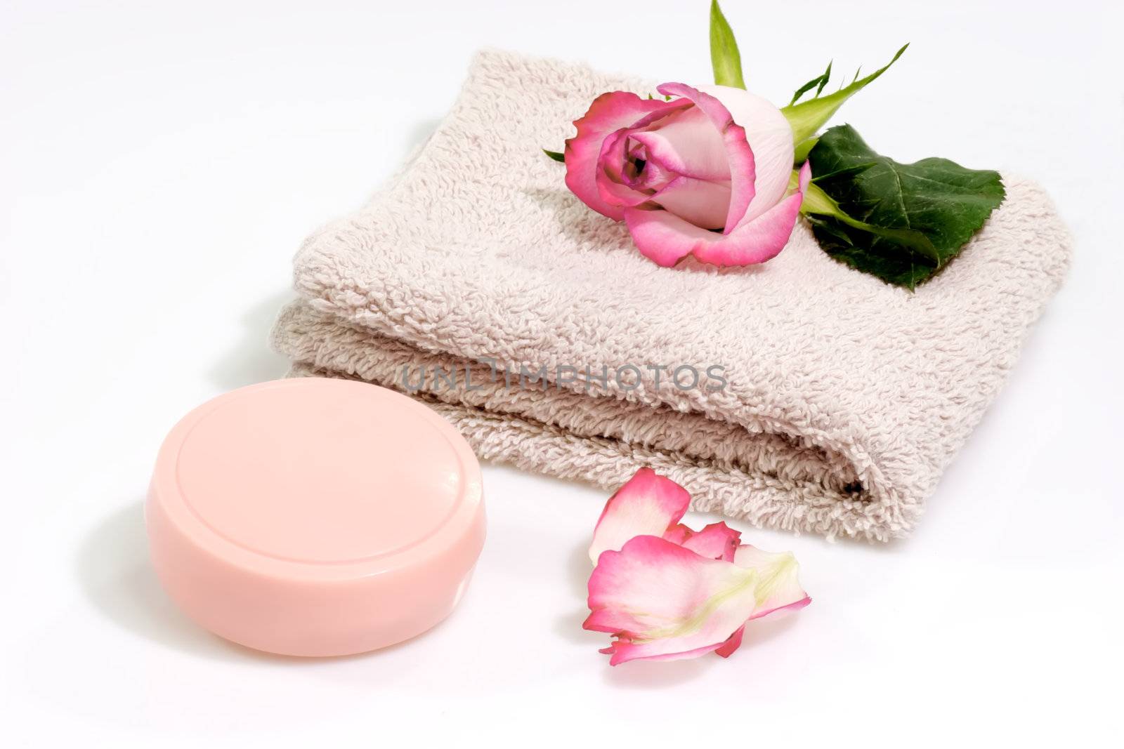 Towel and soap on a bright background