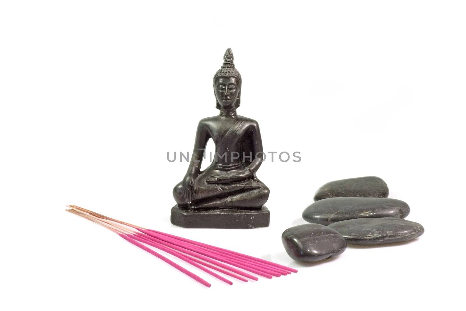 Black buddha statue with black stones and red joss Sticks on white background