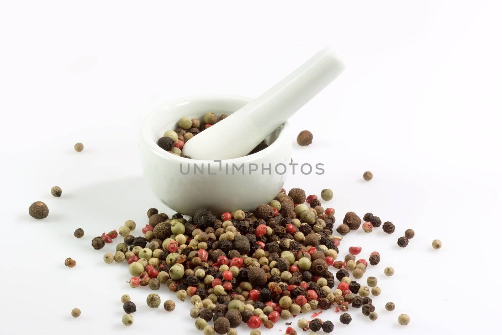 Close-up of pepper grains in four different colors