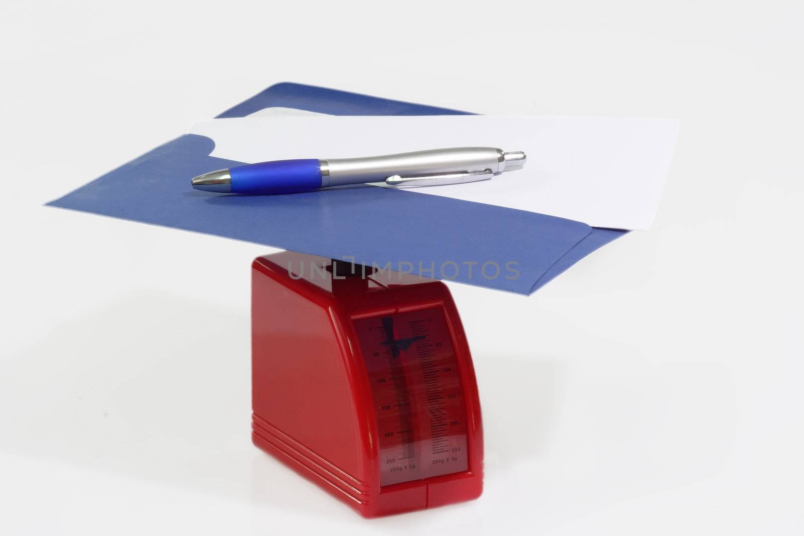 Letter in blue envelope on red letter scale
