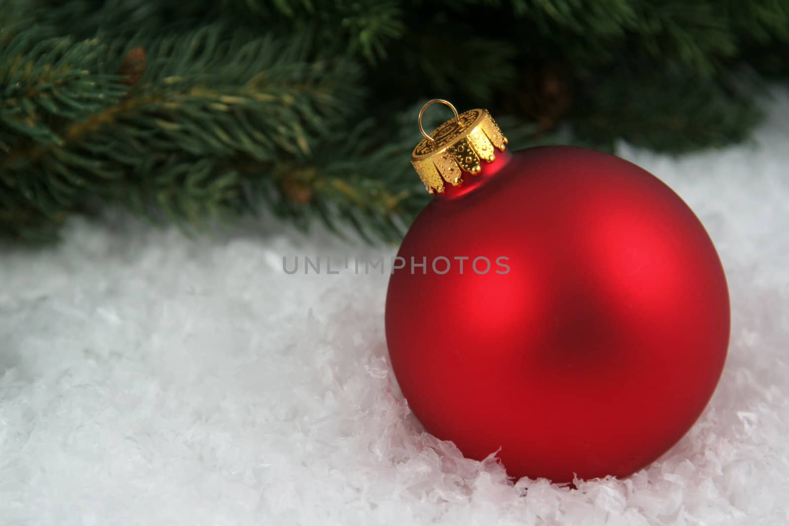 Red Bauble sitting in the Snow by ca2hill