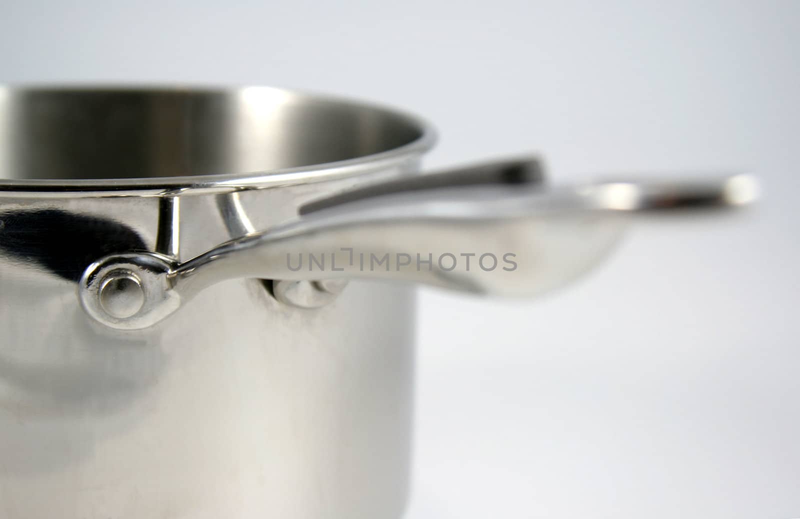 A closeup of a stainless steel pot.
