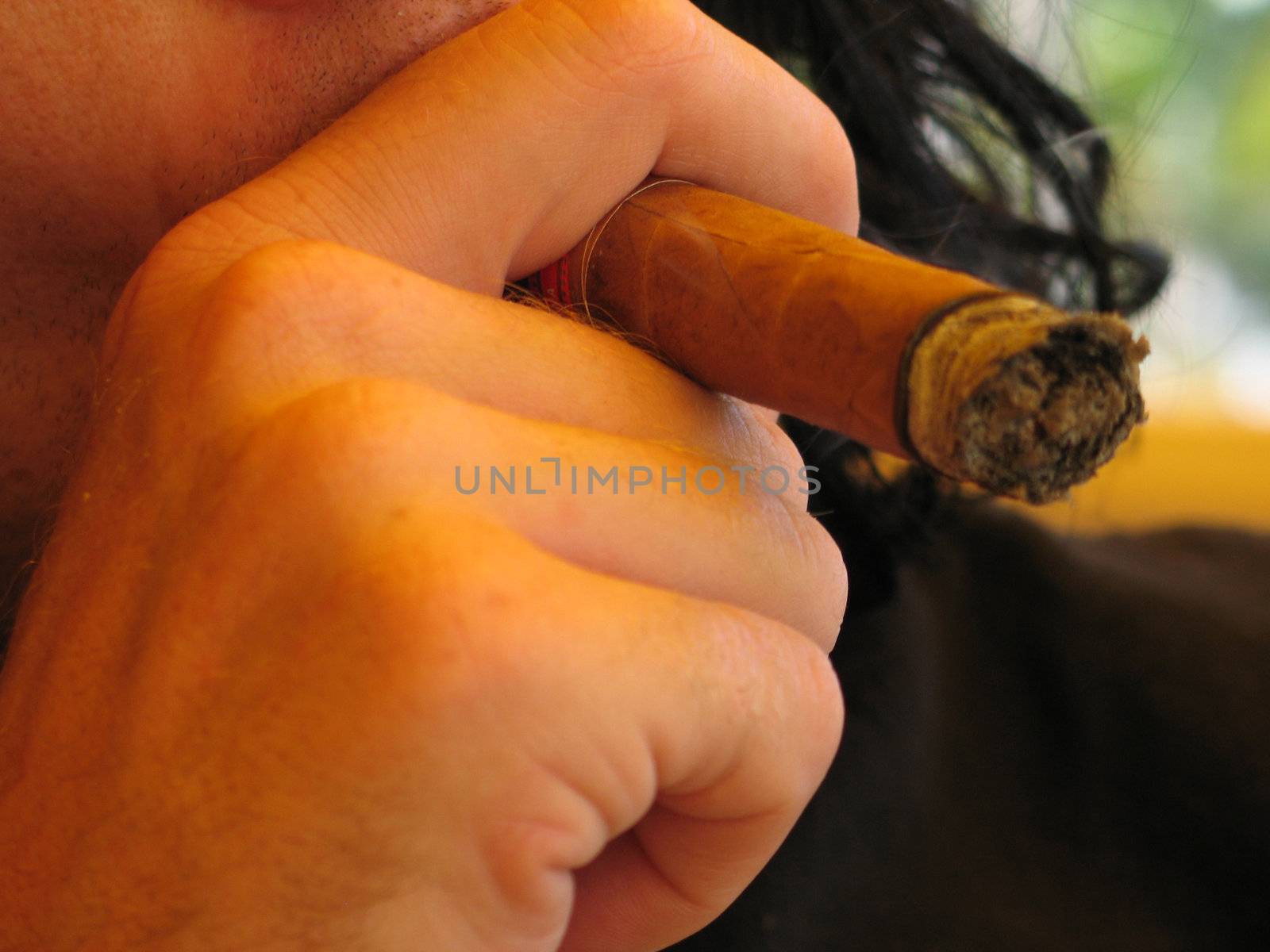 man smoking a cigar by mmm